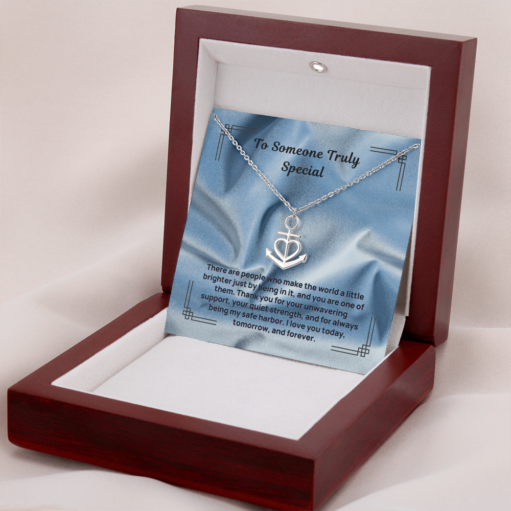 Anchor safe harbor necklace with heart pendant, displayed in open gift box