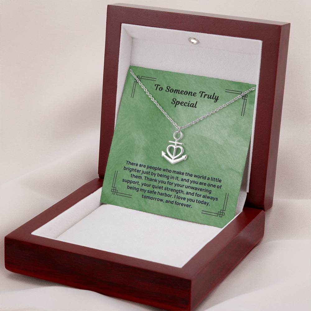 Anchor heart pendant necklace displayed in open gift box with green card