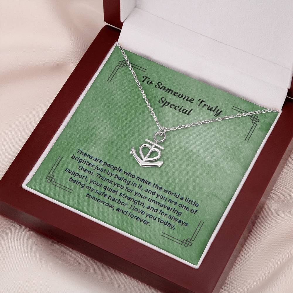 Silver anchor safe harbor pendant necklace in open jewelry box, angled