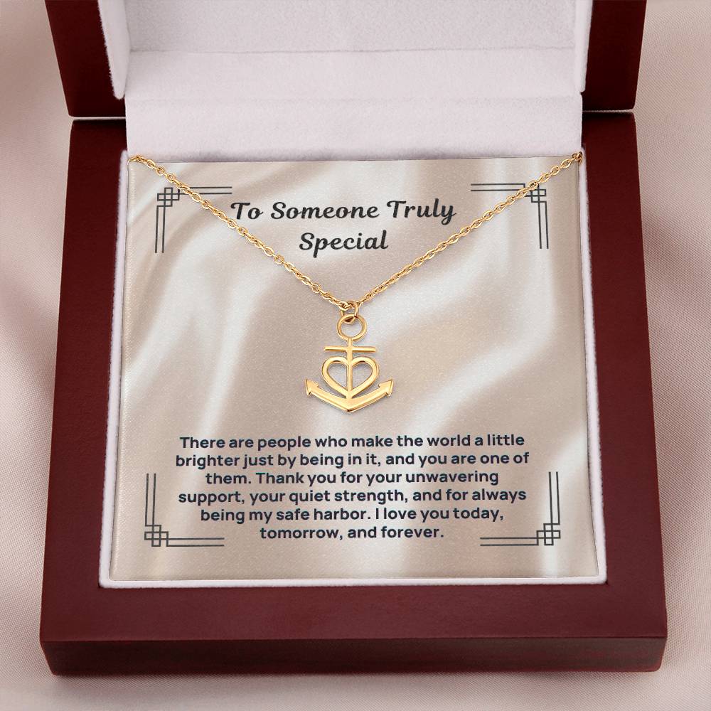 Gold anchor-and-heart pendant necklace displayed in gift box with card insert