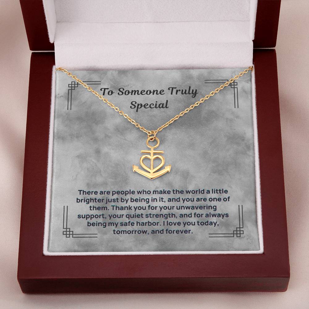 Gold-tone anchor and heart pendant necklace in a red gift box