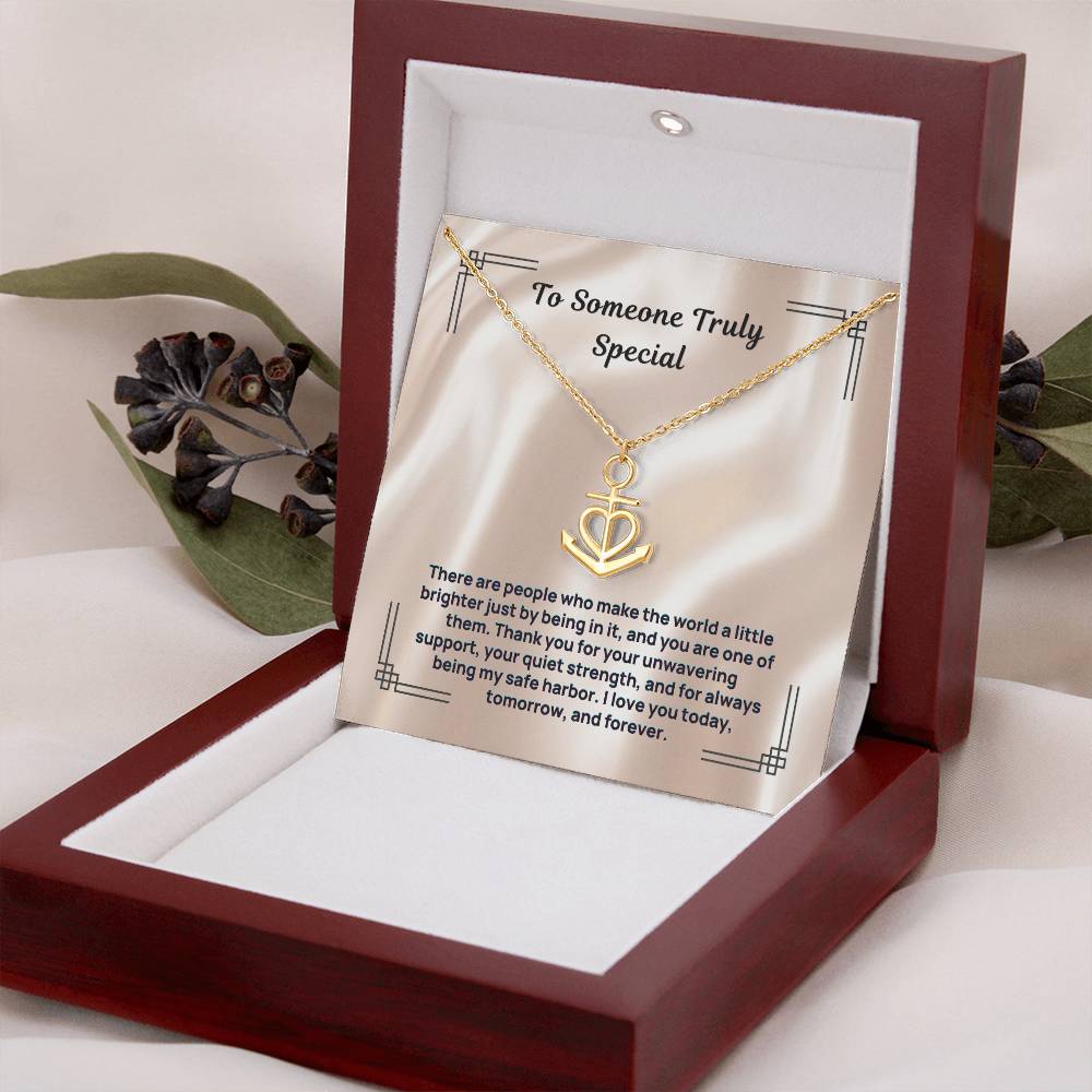 Gold anchor-and-heart pendant necklace in gift box with card insert and lid