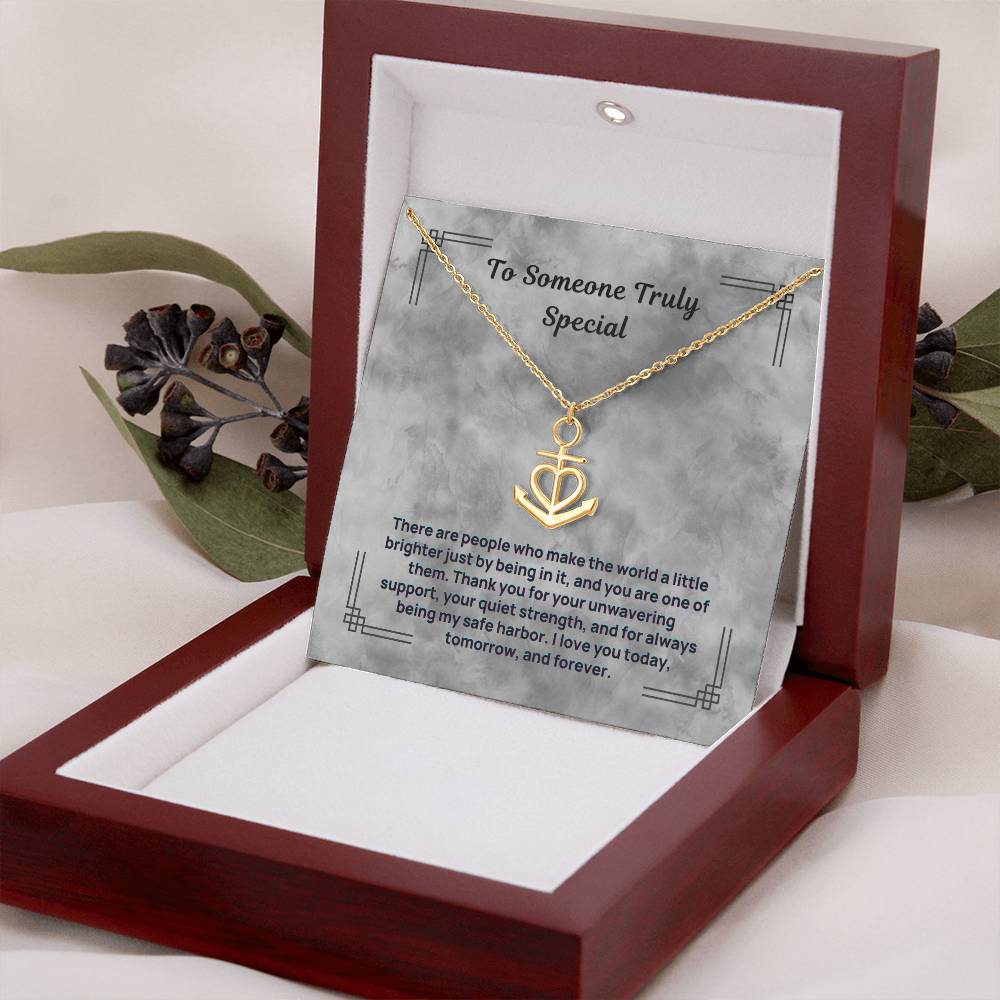 Gold-tone anchor and heart pendant necklace in open red gift box