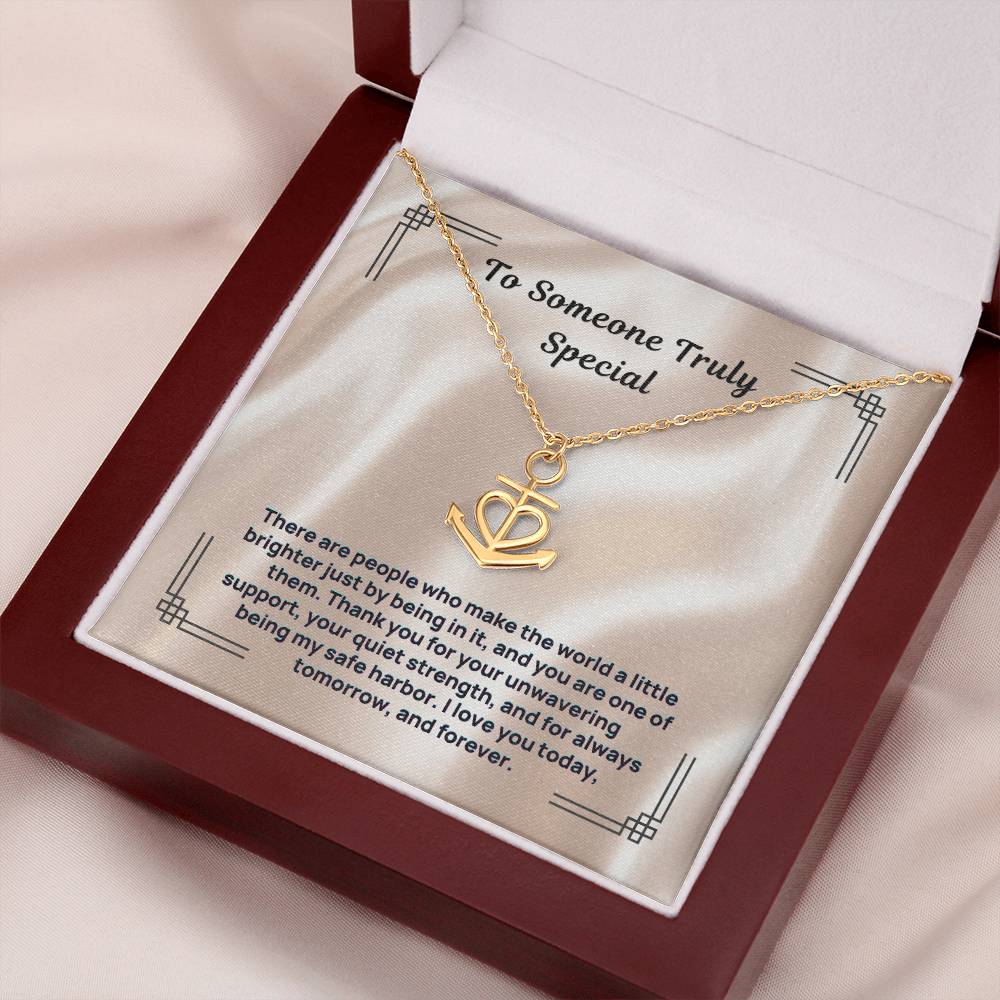 Gold anchor-and-heart pendant necklace with link chain in open gift box
