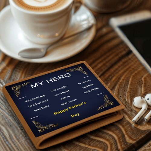 Brown leather wallet with navy “MY HERO” design on a wooden table
