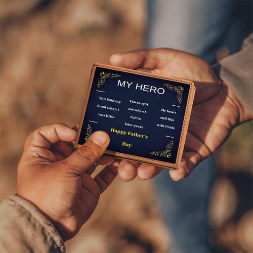 Brown leather wallet held by hands, front panel “My Hero” with “Happy Father’s Day”