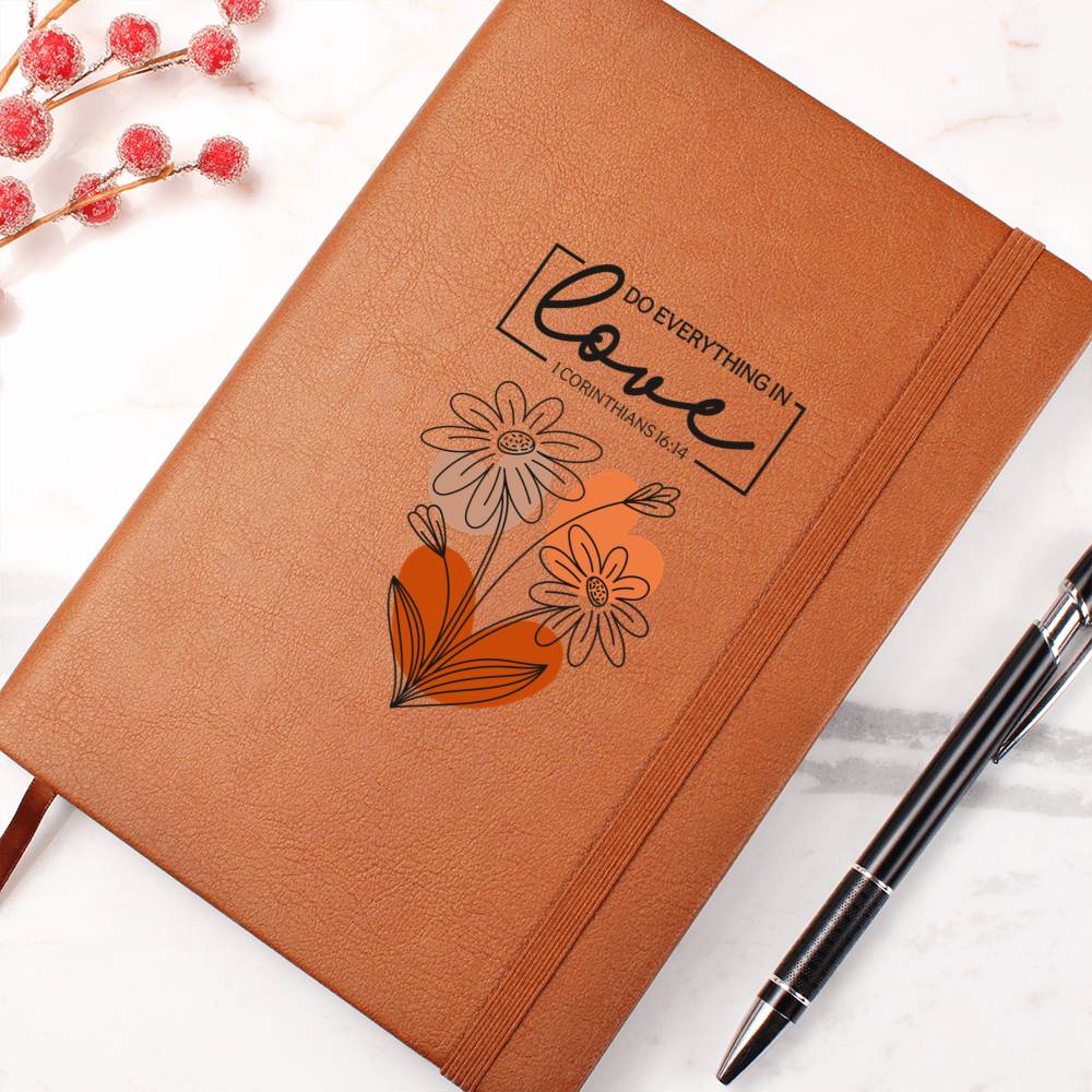 Orange-brown journal cover with floral heart and centered Love scripture quote