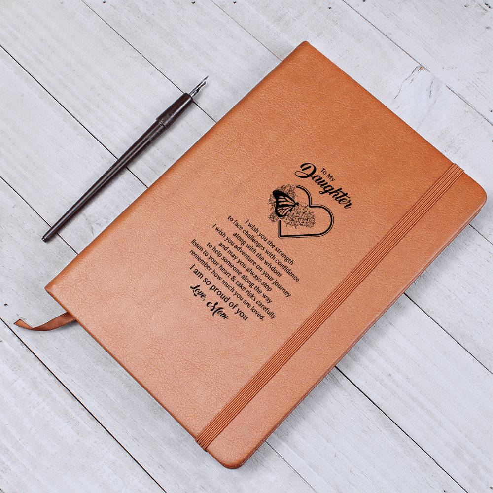 Orange-brown notebook journal with centered heart-and-butterfly message, lay flat