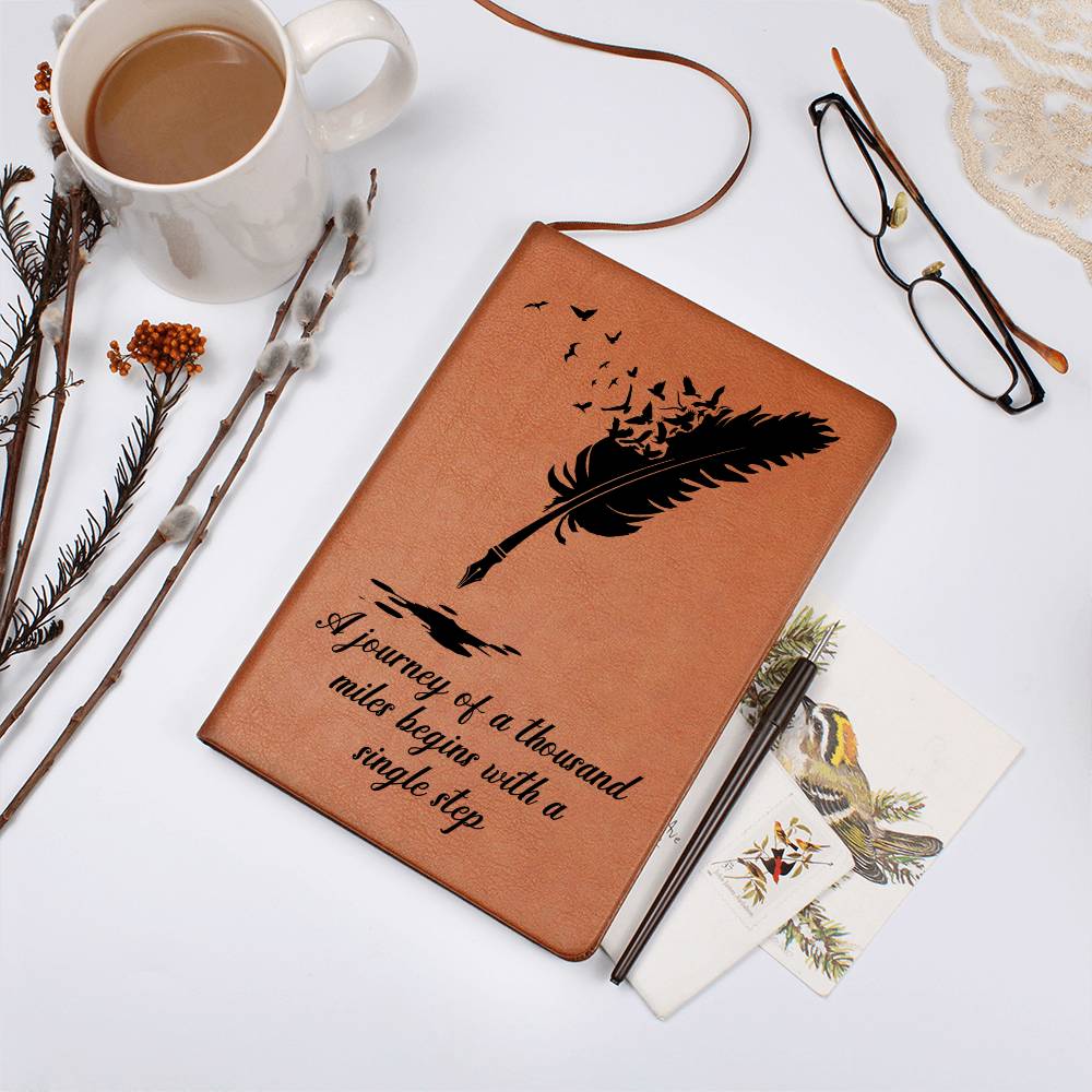 Brown graphic journal with feather-and-birds design and quote front cover