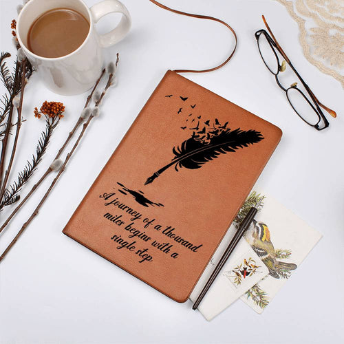 Brown graphic journal with feather-and-birds design and quote front cover