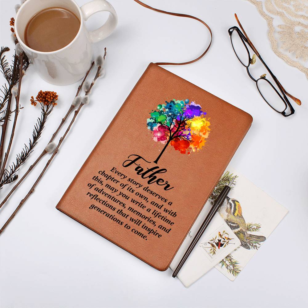 Tan journal with colorful tree of life and 'Father' quote, flat on tabletop
