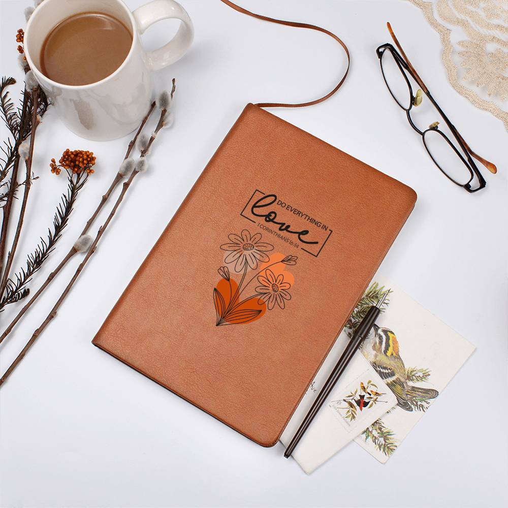 Orange-brown graphic journal with floral heart and Love scripture text on cover