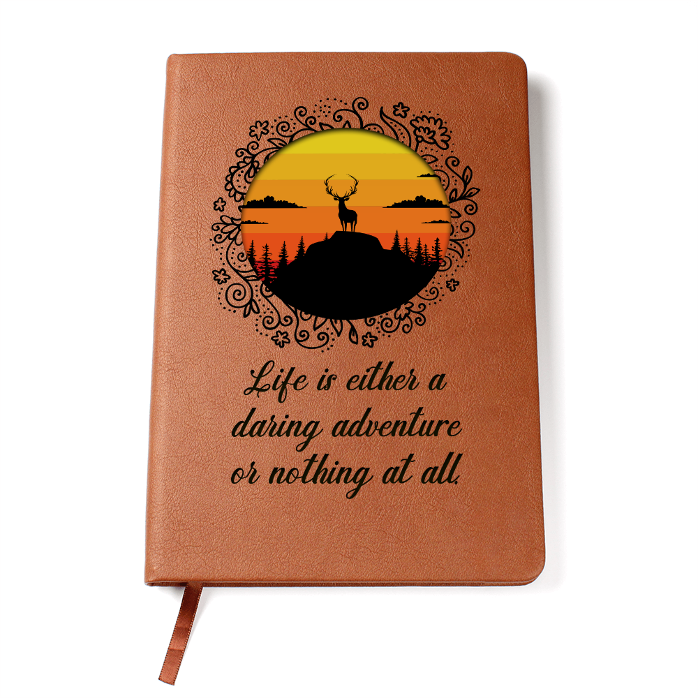 Orange leather-look journal with rider silhouette graphic and script quote