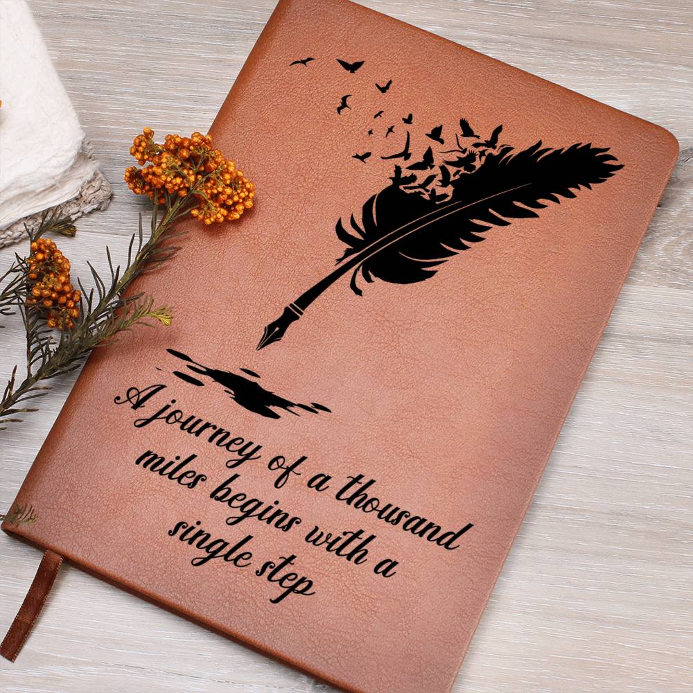 Brown graphic journal with feather graphic and quote text on front cover