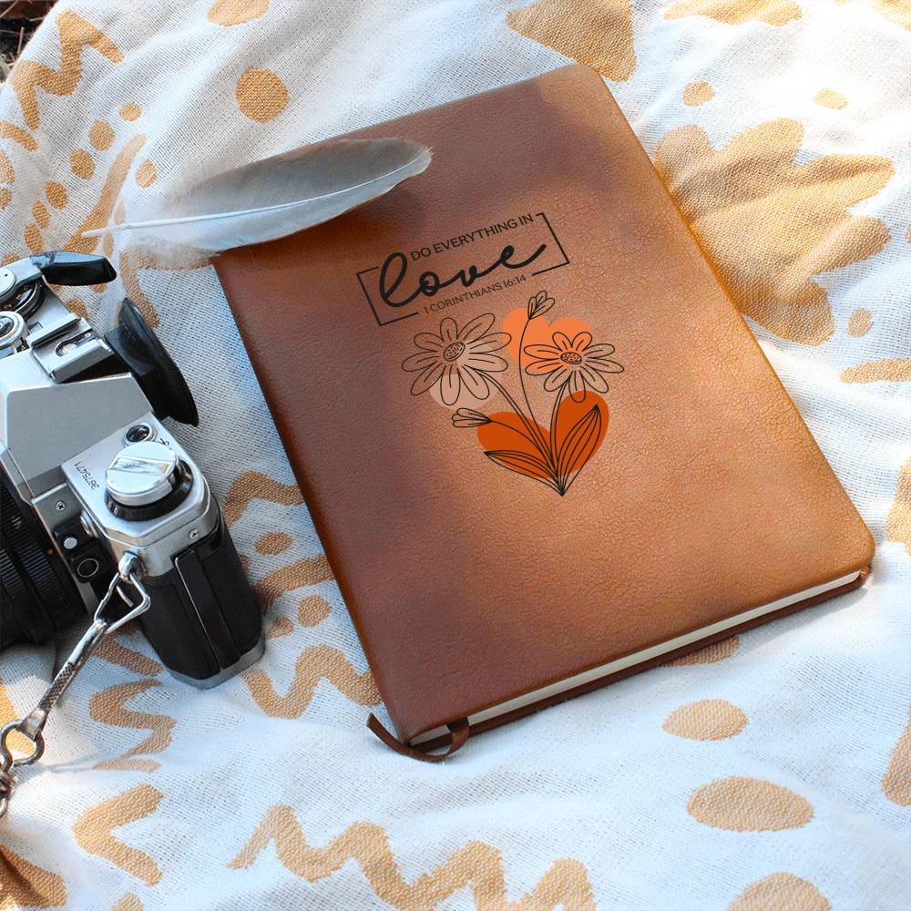 Orange-brown journal with floral heart and Love scripture quote on cover