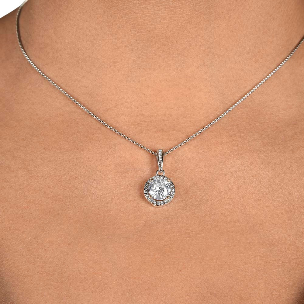 Silver-tone necklace with round halo pendant and clear cubic zirconia stone