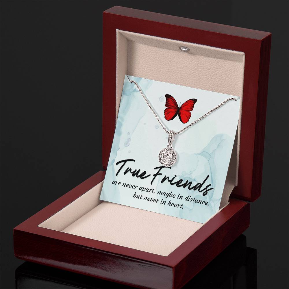 Round halo pendant necklace on display in red gift box with silver-tone chain