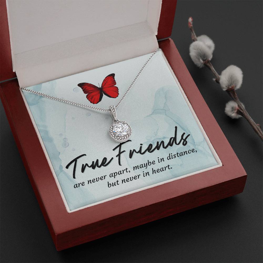 Round halo pendant necklace laid in gift box with silver-tone chain