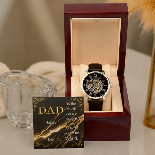 Wood watch box with DAD message card and black leather skeleton wristwatch, upright