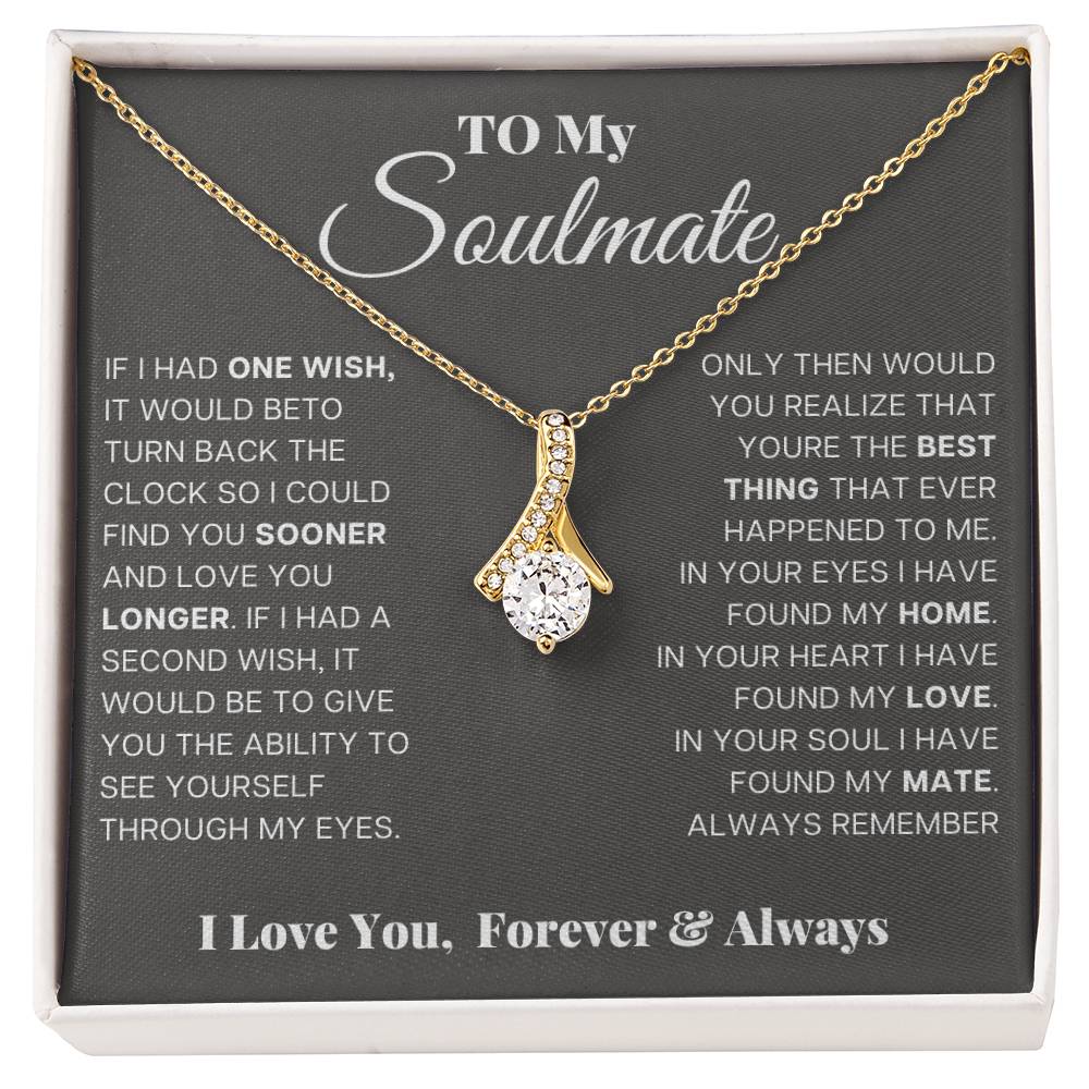 Gold-tone teardrop pendant necklace displayed in gift box