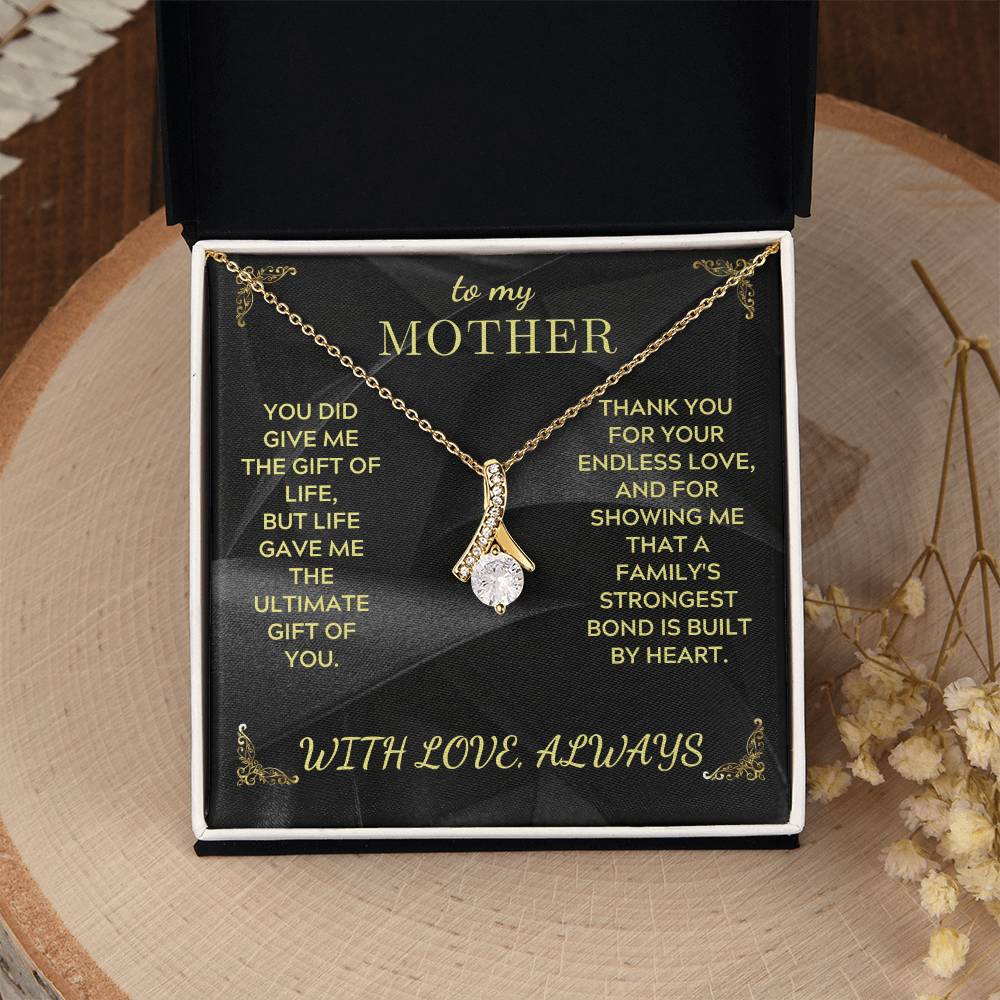 Mother necklace in black gift box, gold-toned chain with teardrop charm pendant on black insert