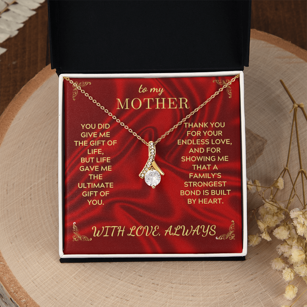 Necklace in red gift box with gold chain and teardrop heart pendant