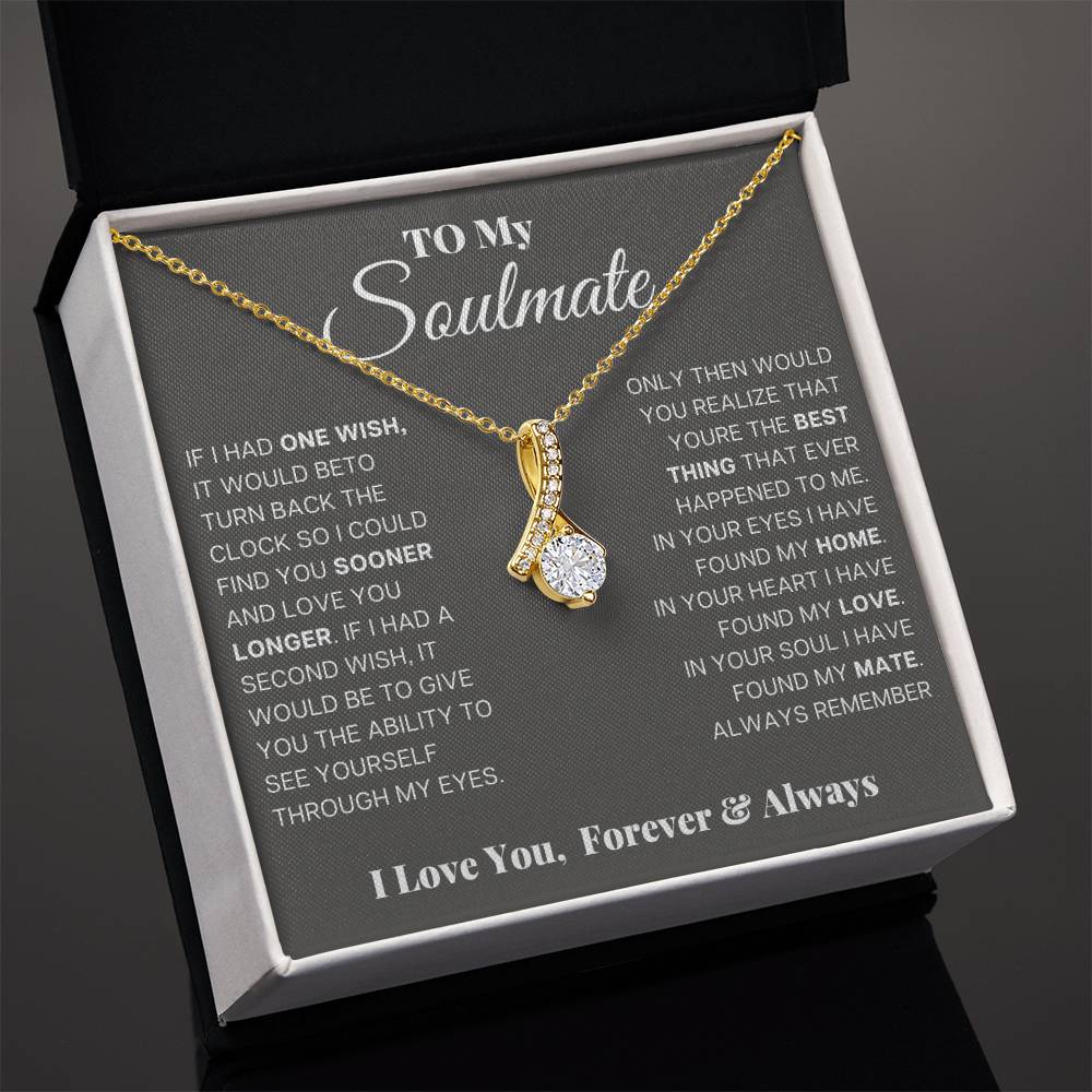Gold-tone teardrop pendant necklace in open gift box