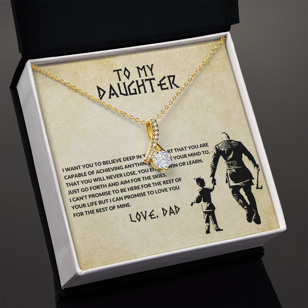 Gold-tone chain necklace with crystal heart pendant and bow-shaped center charm