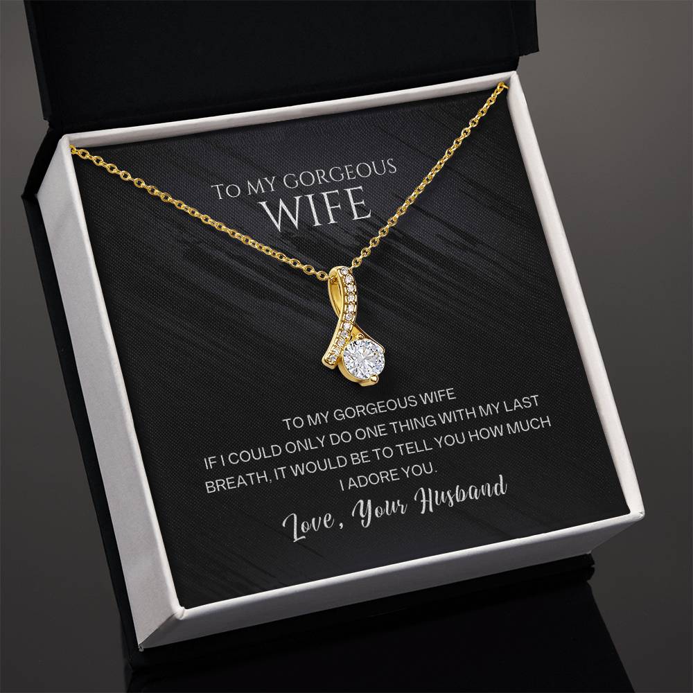 Gold-tone wife pendant necklace with teardrop crystal charm, angled gift box view