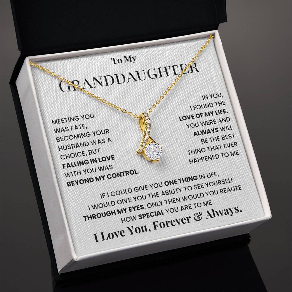 Gold-tone teardrop crystal pendant necklace inside message gift box on display