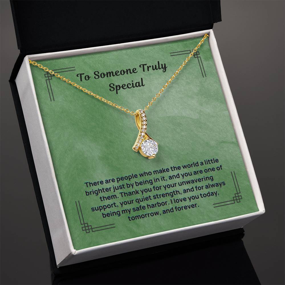 Gold-tone teardrop pendant necklace with sparkling stones and fine chain