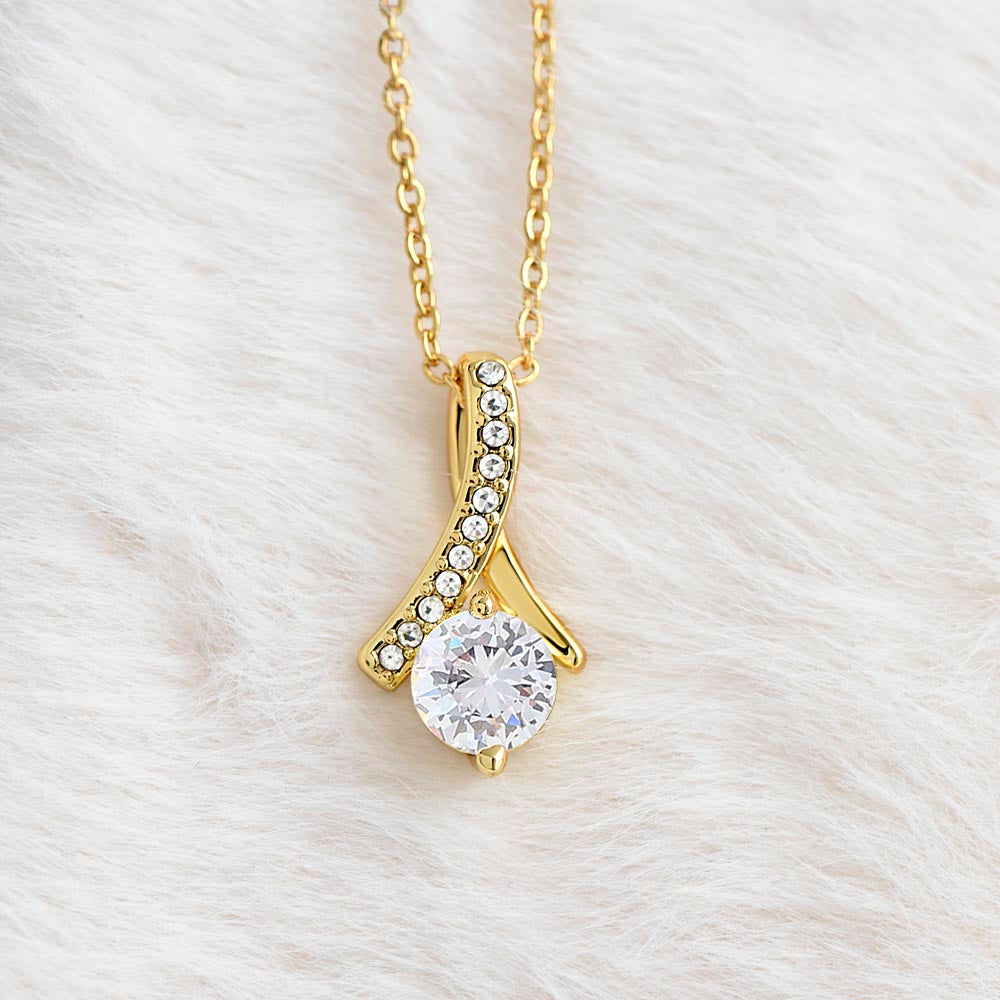 Gold-tone teardrop pendant necklace with round crystal center stone