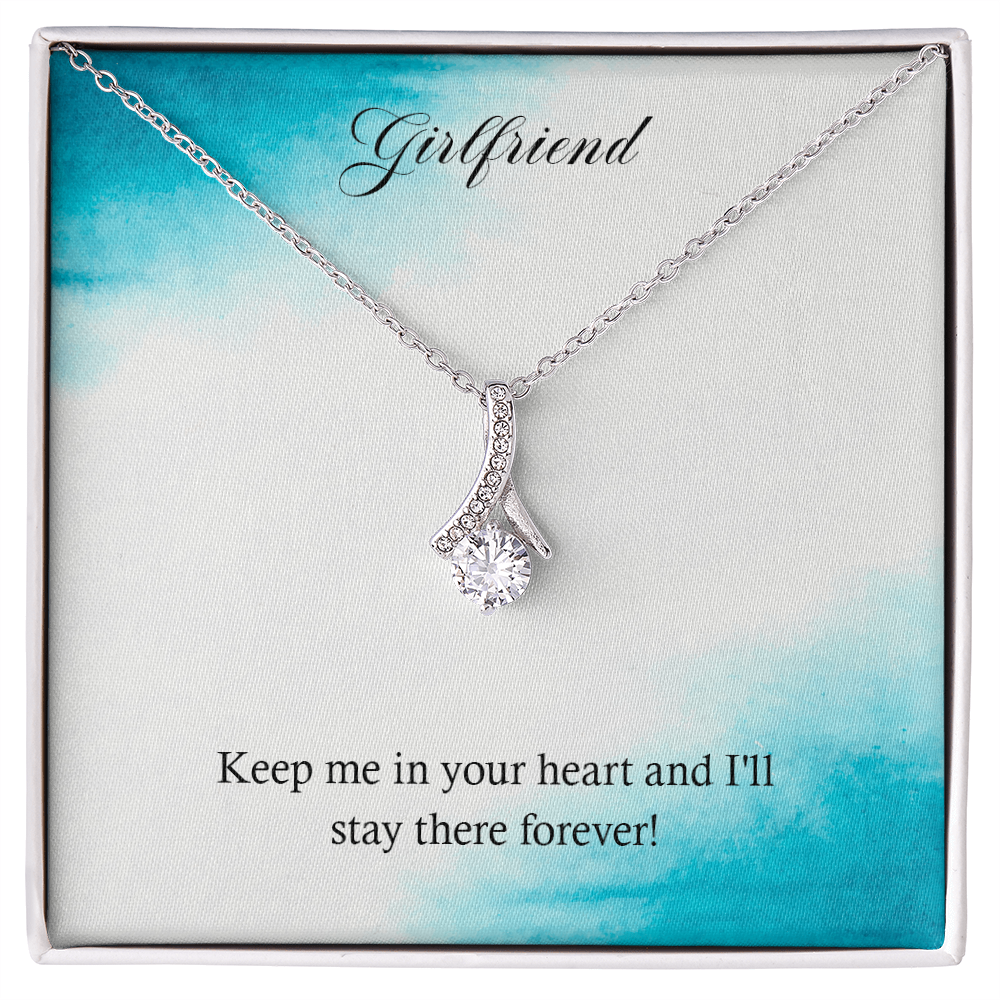 Silver-tone heart teardrop pendant necklace in a gift box with chain and clasp.