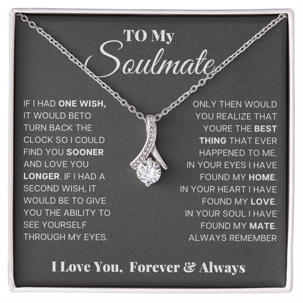 Silver-tone teardrop pendant necklace displayed in gift box