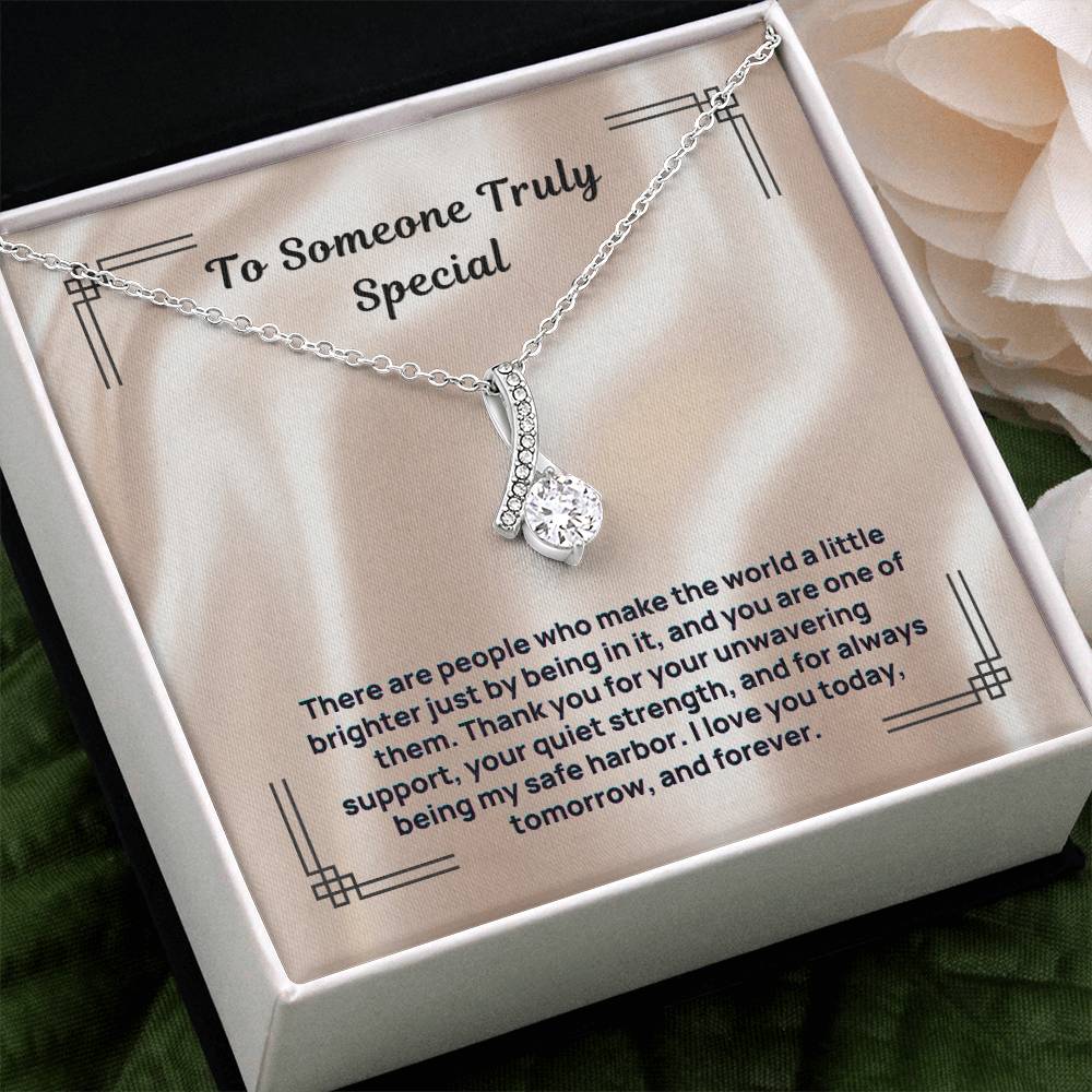 Silver-tone “To Someone Truly Special” necklace laid in gift box
