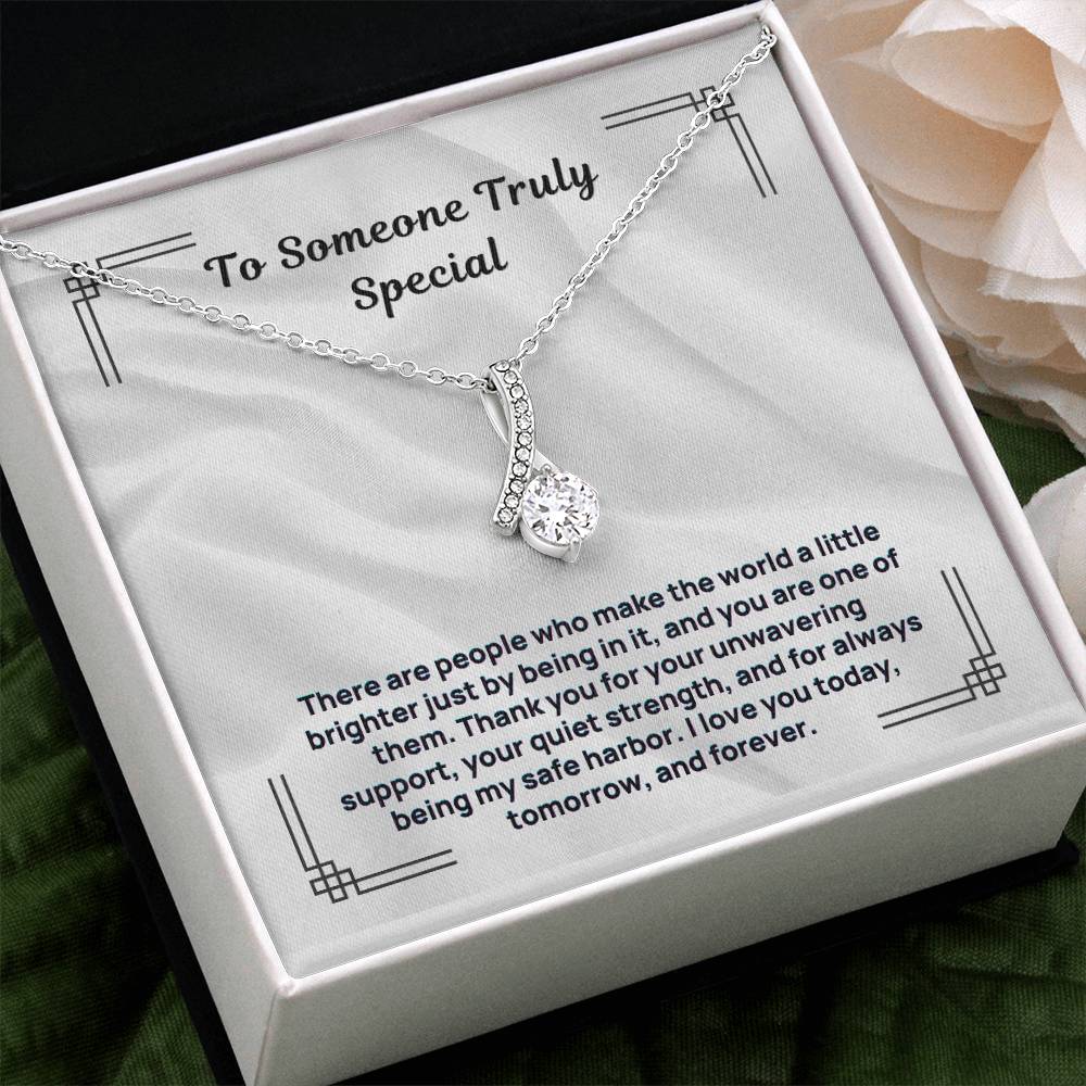 Silver-tone necklace with teardrop crystal pendant and linked chain, in box