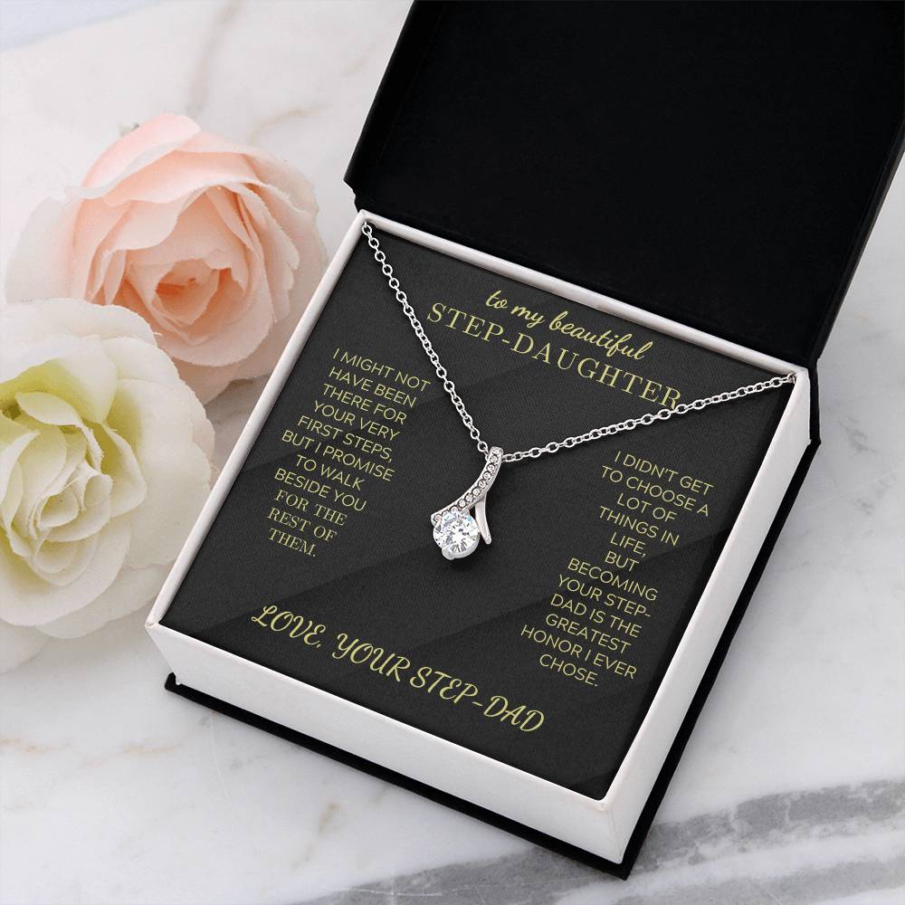 Silver-tone necklace with teardrop crystal pendant in black gift box with flowers.