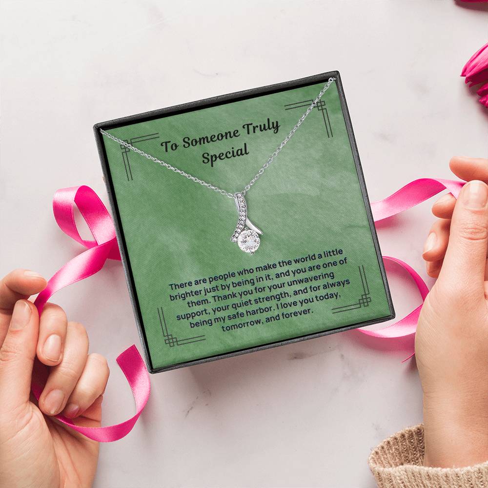 Silver-tone teardrop pendant necklace in a green gift box with ribbon