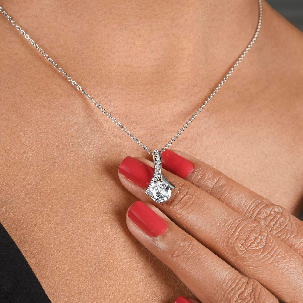 Silver-tone teardrop heart pendant necklace close-up on neckline