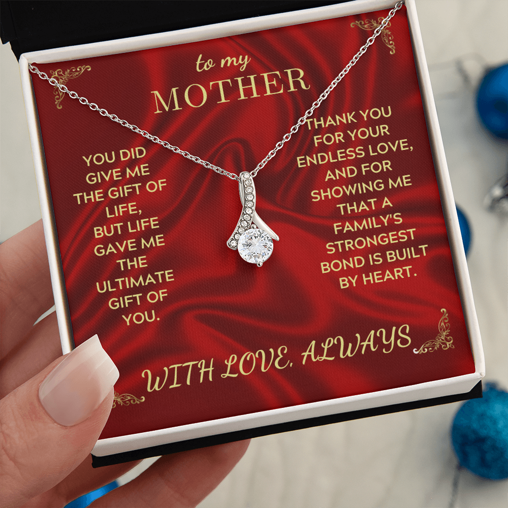 Silver-tone teardrop crystal heart pendant necklace on red gift card in box
