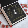 Silver-toned necklace with teardrop pendant and small clear stones, box set