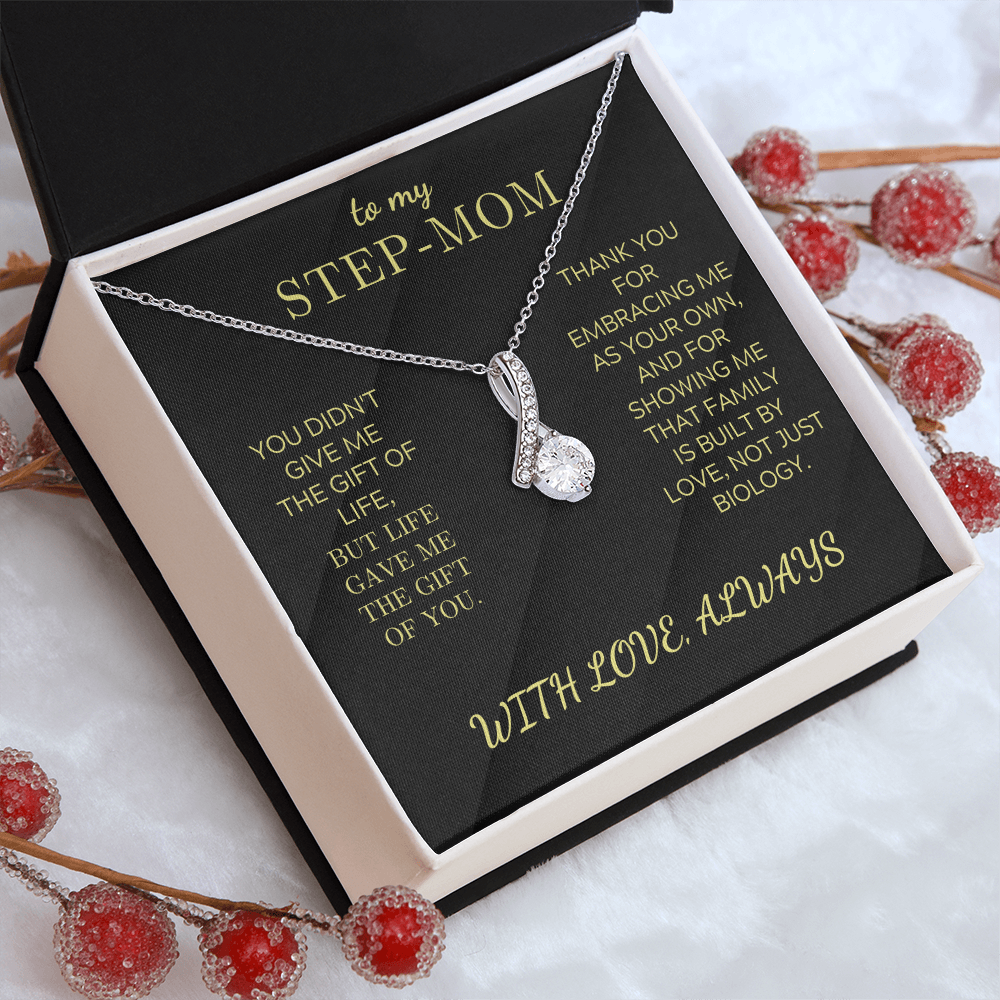 Silver-toned necklace with teardrop pendant and small clear stones, box set