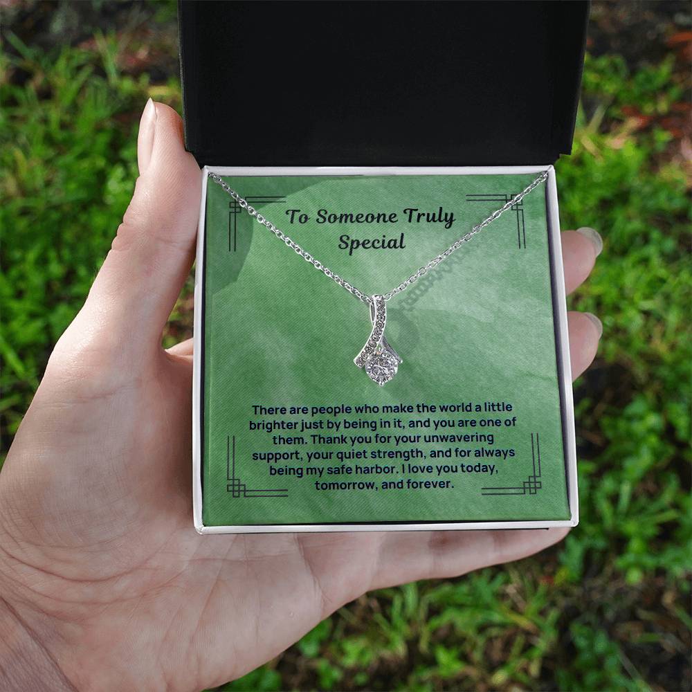 Silver-tone teardrop pendant necklace with sparkling stones and chain