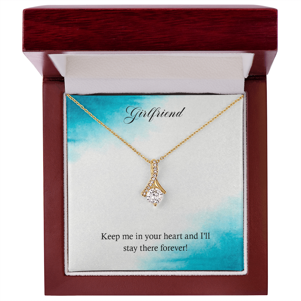 Gold-tone heart teardrop pendant necklace in a red wooden gift box.
