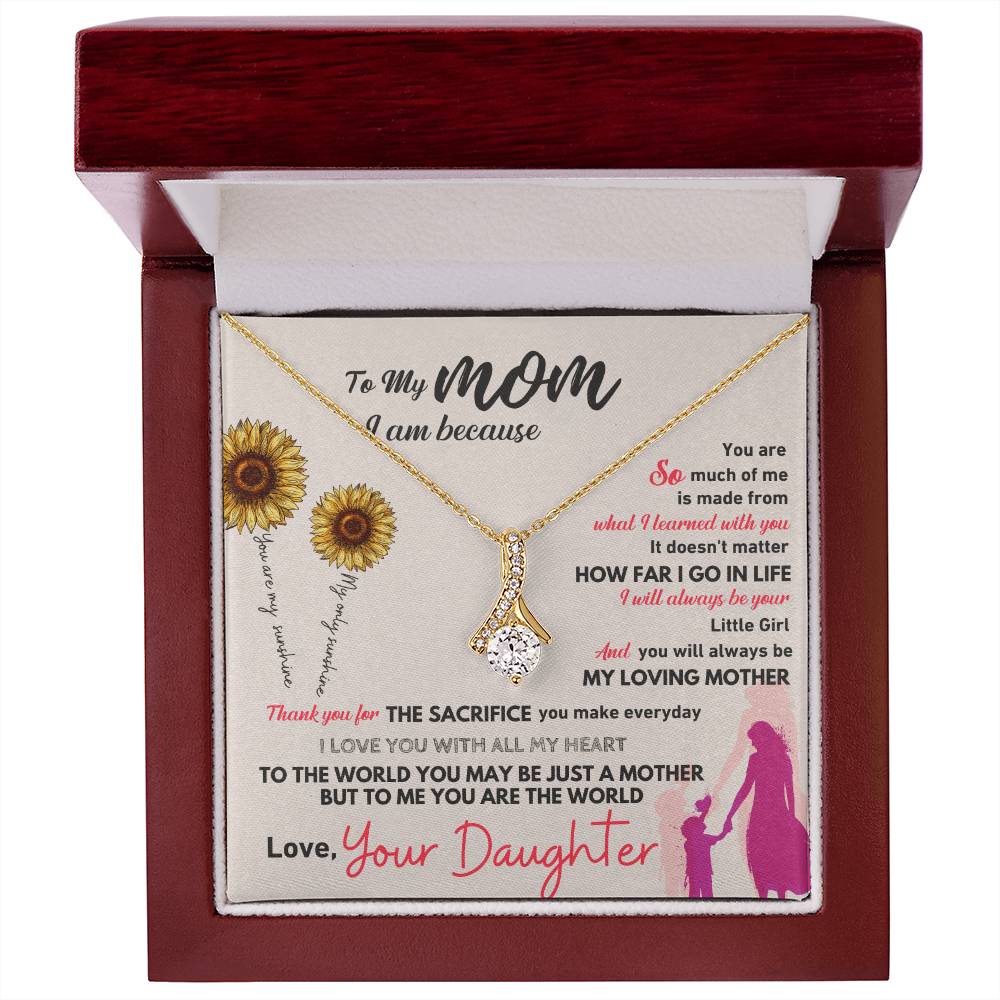 Gold-tone necklace with teardrop pendant in red wooden gift box