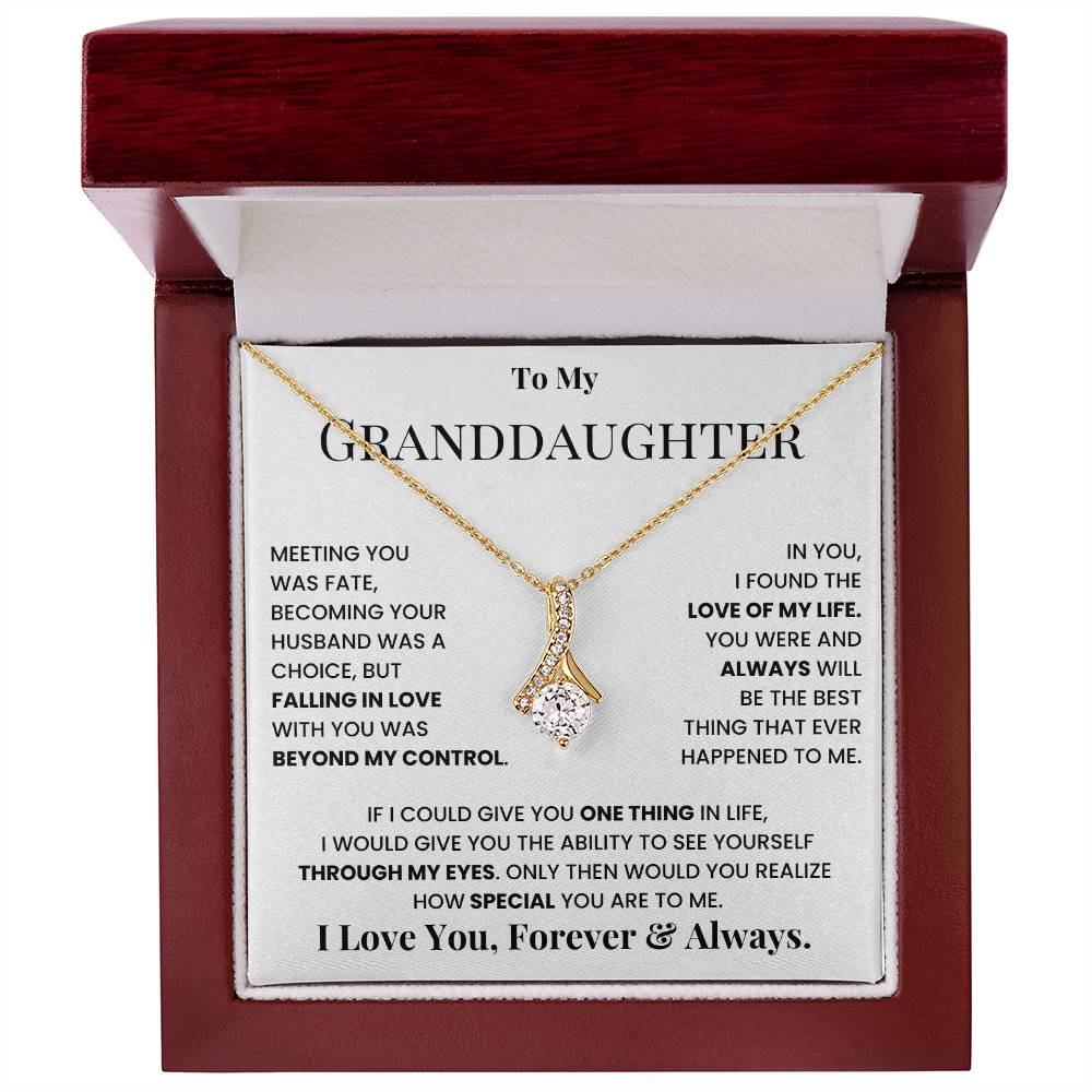 Gold-tone teardrop crystal pendant necklace inside message gift box with red lid