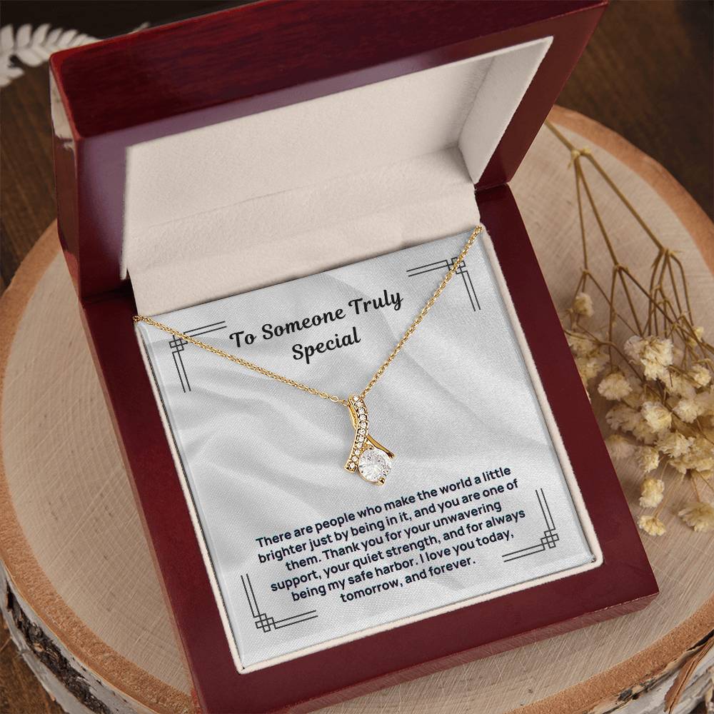 Gold tone pendant necklace with “To Someone Truly Special” message card in maroon gift box
