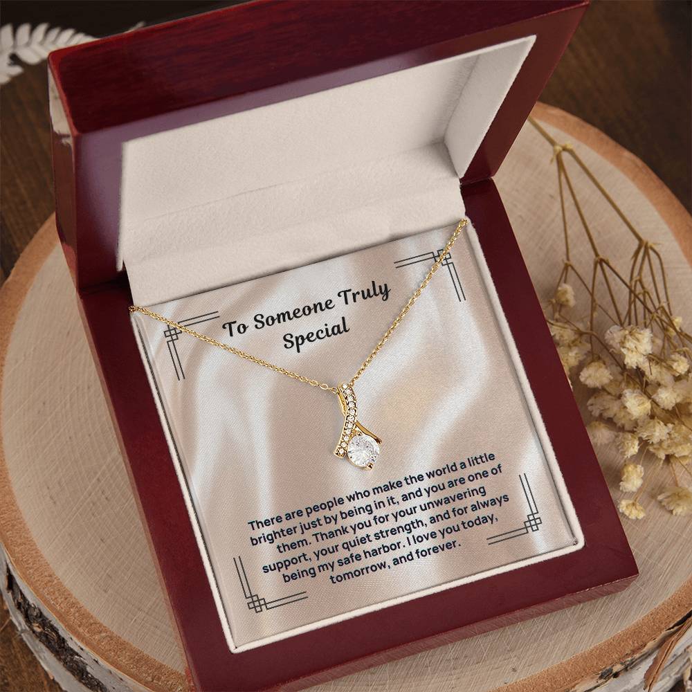 Gold-tone stone pendant necklace in red presentation box with white card insert
