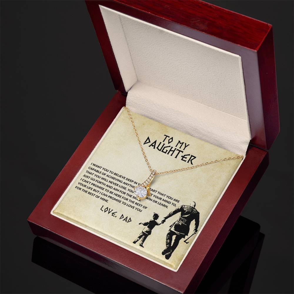 Gold-tone chain pendant necklace with crystal heart and bow-shaped center charm in box