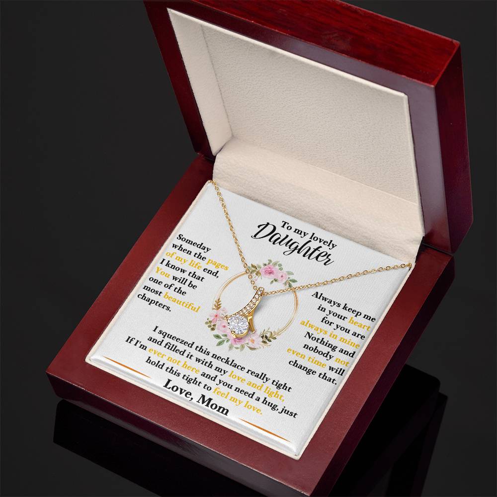 Gold-tone daughter keepsake necklace in open red gift box, floral heart pendant and chain